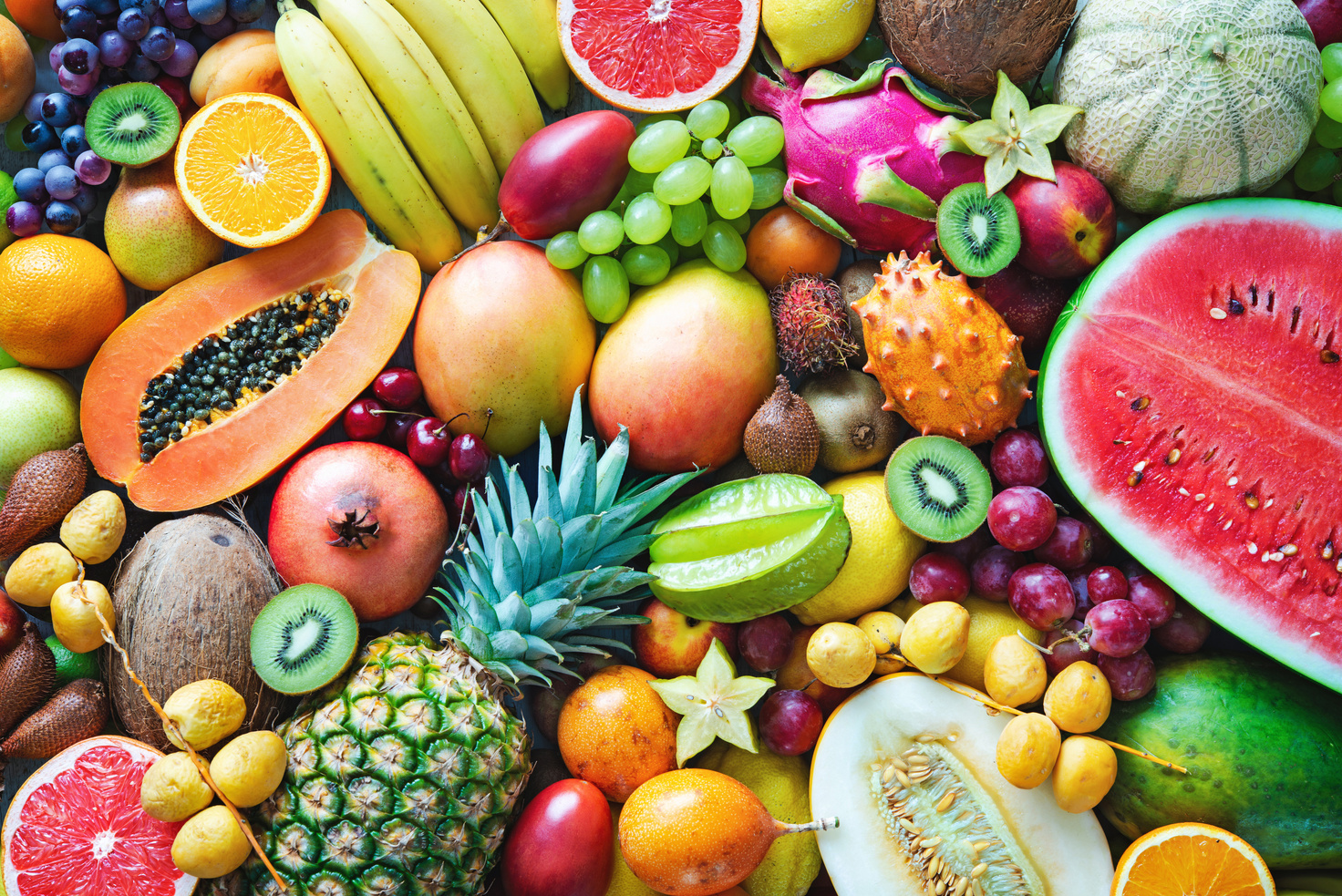 Assortment of colorful ripe tropical fruits. Top view