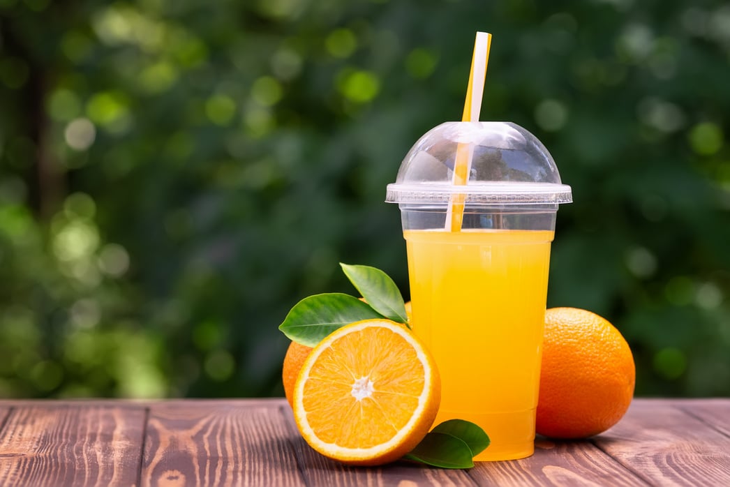 orange juice in plastic cup