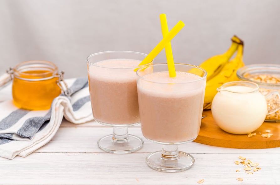 Milk shake with banana, oatmeal and honey, healthy breakfast